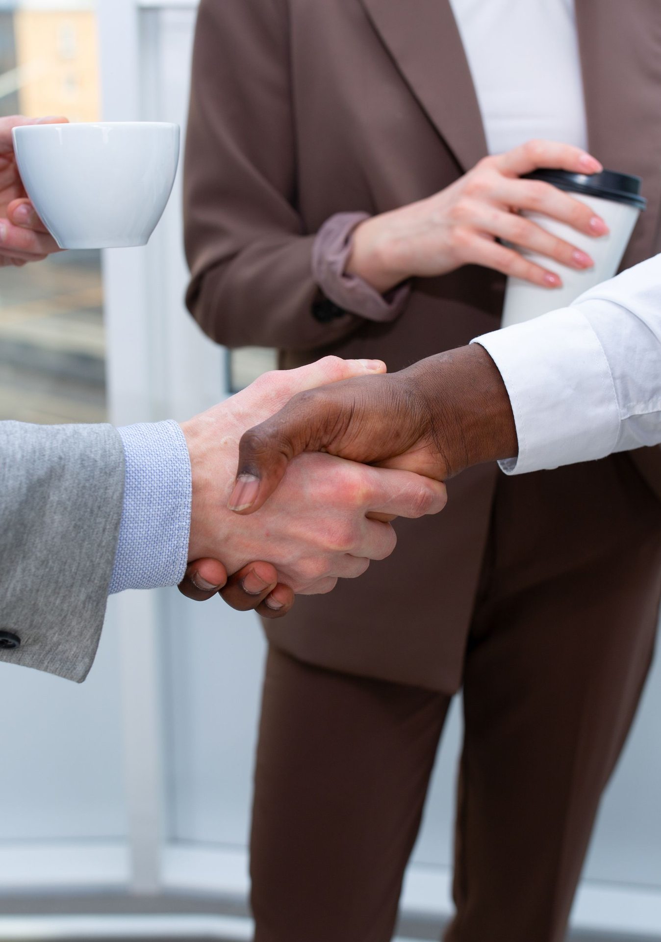 Business professionals shaking hands in a meeting