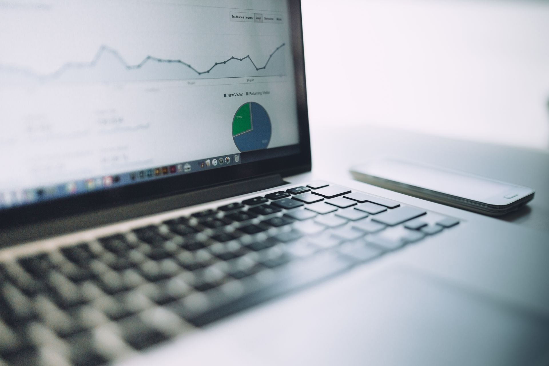 Laptop showing marketing performance charts