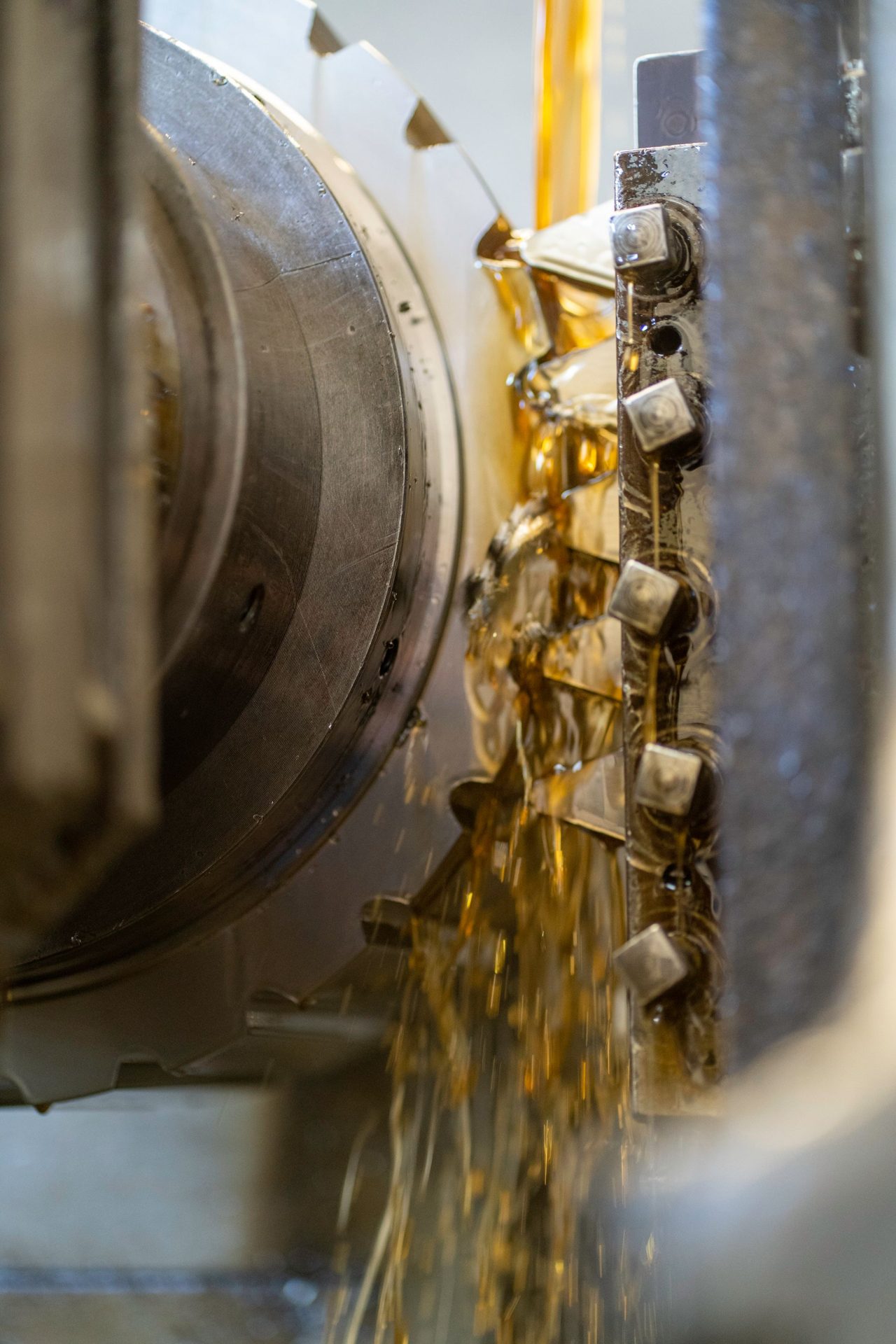 Close-up of precision gear cutting on an industrial machine